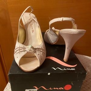 Nina’s dressy beige shoes with open toes